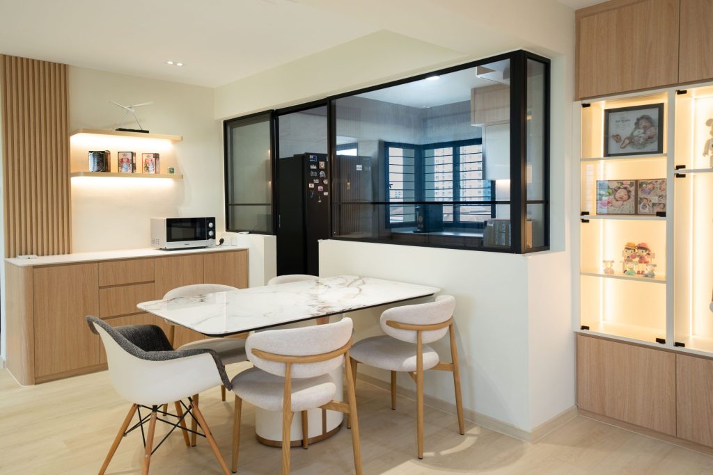 HDB living room with glass partition with kitchen